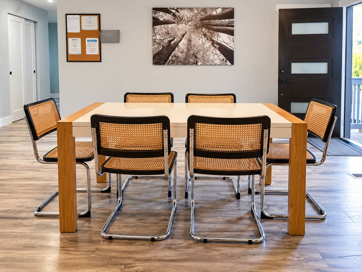 Dining table with cane-back chairs in a bright room