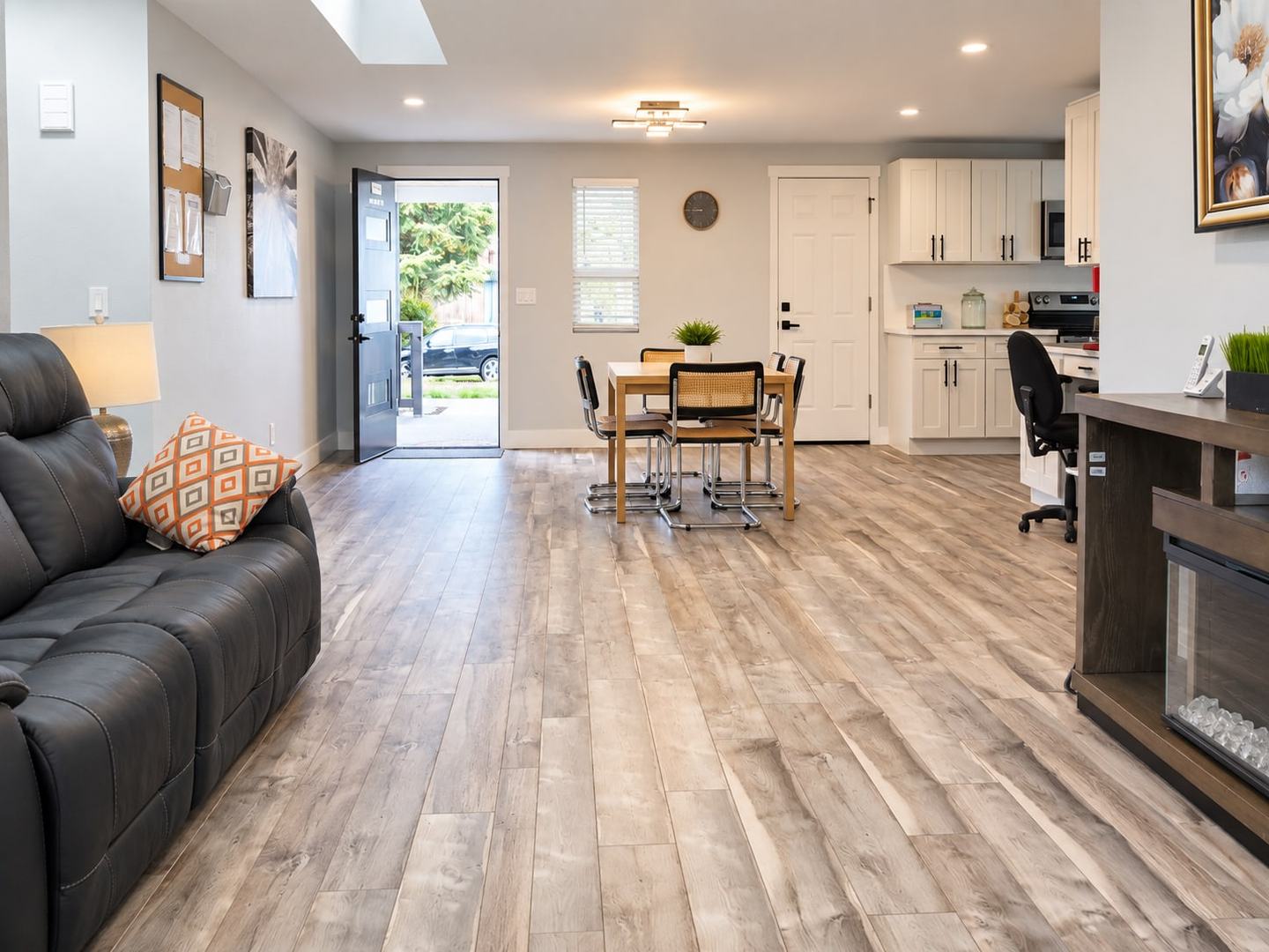 Open living area looking toward the dining table and kitchen